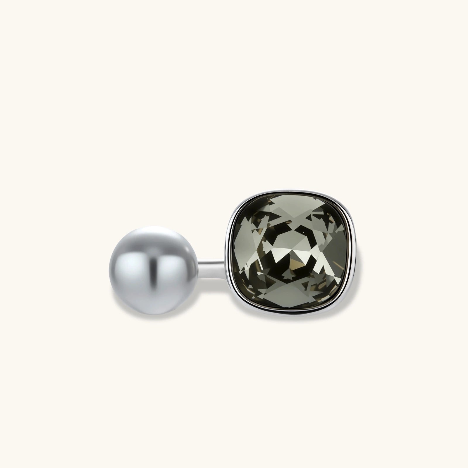 Modern adjustable ring with smoky zircon stone and metallic sphere in platinum-plated copper finish on neutral background.