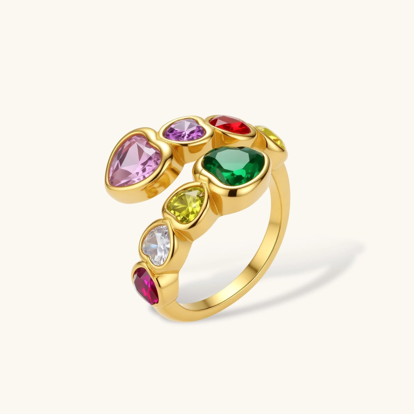 Gold-plated wrap ring with bezel-set multicolor heart-shaped cubic zirconia stones in pink, purple, green, red, yellow, and white.